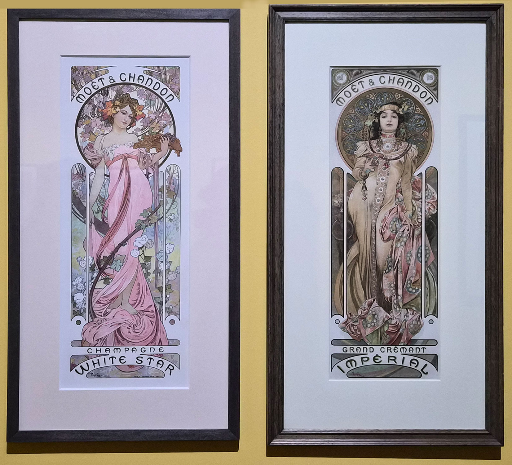 모엣 샹동(Moët & Chandon)의 샴페인 광고를 위해 제작한 포스터 1899 화이트 스타(White Star), 그랑 크레망 임페리얼(Grand Crémant Impérial) 두 작품은 쌍으로 이루어진 포스터 작품이다. 화이트 스타, 그랑 크레망 임페리얼
왼쪽은 분홍색 드레스를 입은 여성이 꽃을 들고 있는 모습의 화이트 스타이다.오른쪽은 화려한 장신구와 노란색 계열의 드레스를 입은 신비로운 분위기의 여성은 그랑크레망 임페이얼이다.특히 이 작품은 표정이 매우 거만하여 인상 깊다.The two works are a pair of posters: White Star, Grand Crémant Impérial On the left is White Star, a woman in a pink dress holding flowers.On the right is Grand Crémant Imperial, a mysterious woman in a yellow dress and ornate jewelry.This work is  articularly striking for its haughty expression.